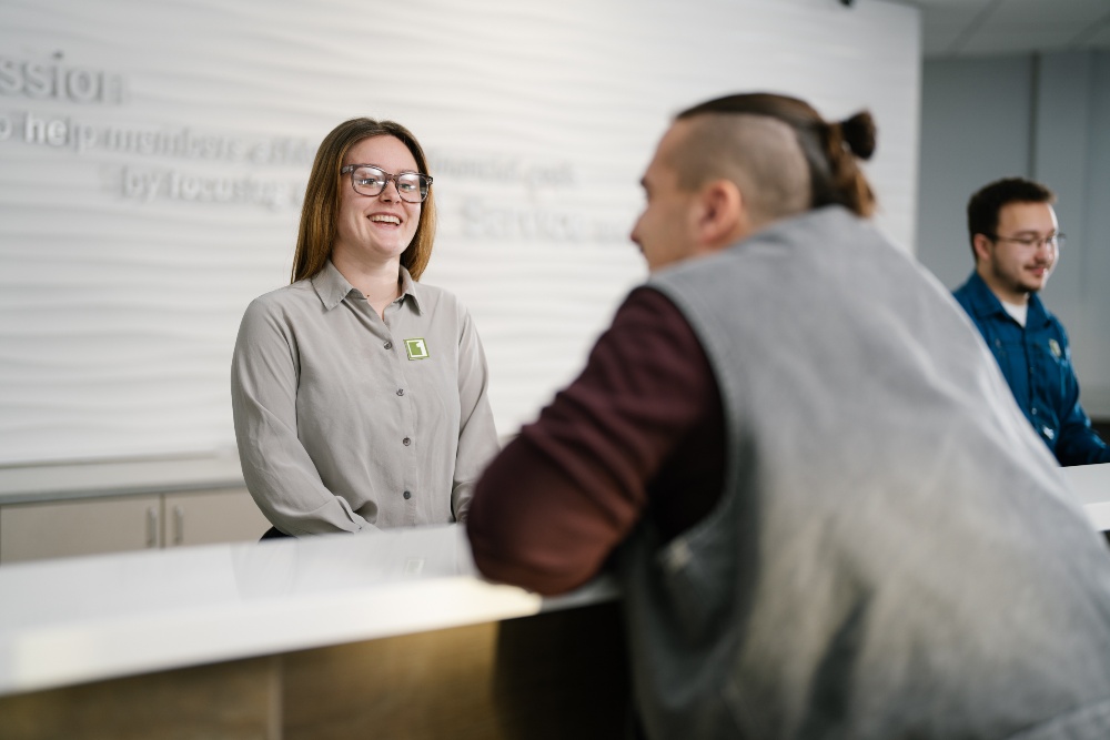Soldotna Branch Employee and member talking